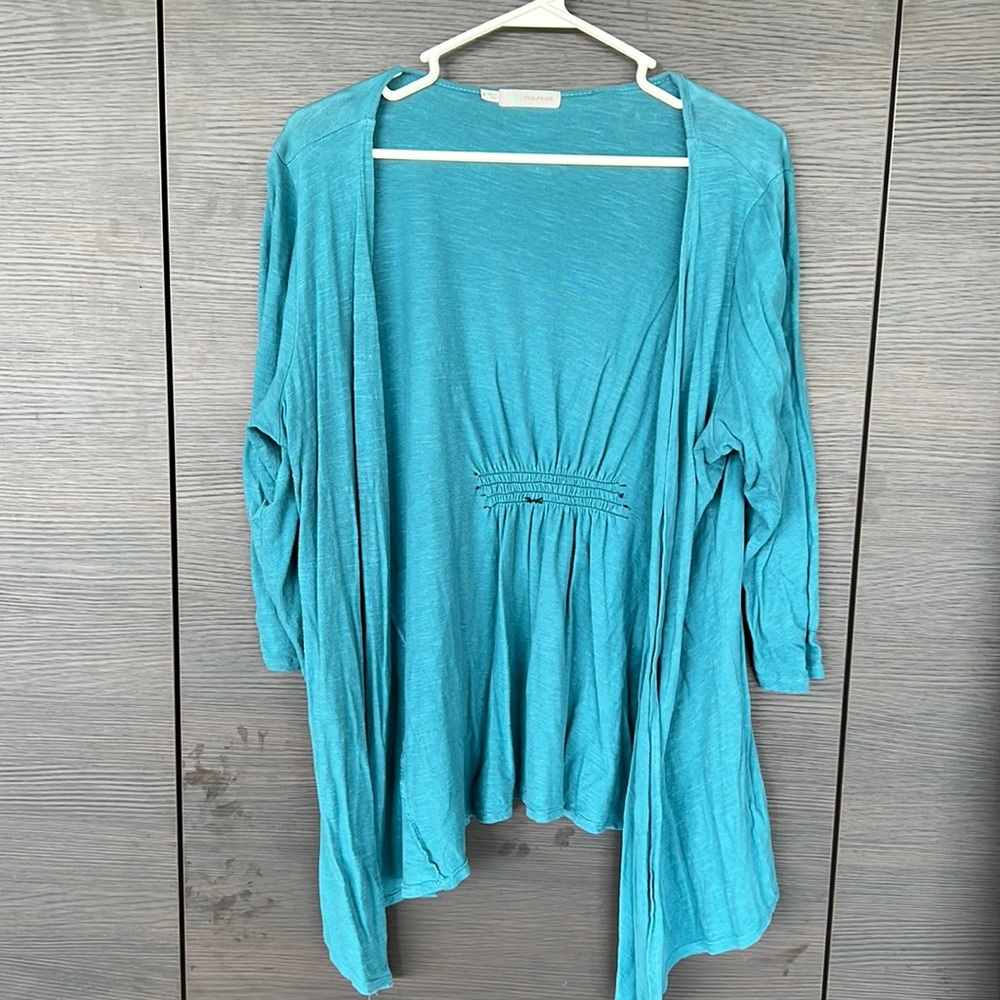 Maurice’s teal cardigan